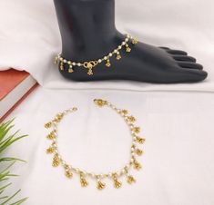 "Kundan Payal/Kundan Anklets/Indian Payal/Indian Anklets/Indian Jewelry/Polki Payal/Sabyasachi Payal/Pajeb/Indian Jewelry/Indian Bridal Payal Features: - Length: 10\"-11\" - Indian Kundan Anklets in Golden finish. - Very Elegant and stylish, this set can be paired with any Attire depending upon the occasion and the theme. - The base is pure brass which makes this very sturdy and of good quality. - 100% guarantee on the polish- it will not lose its finish/color/shine. - Very lightweight and Hand White Anklets With Latkans, Traditional White Anklets For Festive Occasions, White Festive Anklets With Latkans, White Latkans Anklet For Festive Occasions, White Latkans Anklets For Festive Season, Festive White Anklets With Latkans, Festive White Latkans Anklets, Kundan Anklets, Kundan Payal