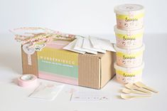 several rolls of washi tape sitting on top of a box next to other items