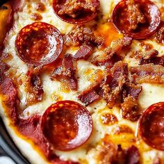 a pizza with pepperoni and sausage on it