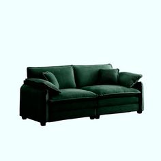 a green couch sitting on top of a white floor