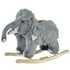 an elephant toy sitting on top of a wooden rocking horse