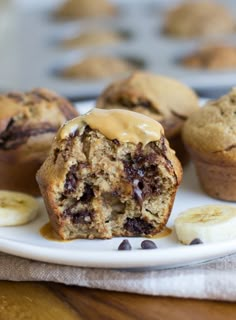 banana chocolate chip muffins on a white plate