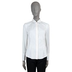 100% authentic Brunello Cucinelli poplin button-down shirt in white cotton (72%), polyamide (23%) and elastane (5%) - please note the content tag has been removed). Features sterling silver tubular buttons at the collar and cuffs, cuffs are lined in grey cotton. Closes with concealed buttons down the front. Has been worn and is in excellent condition. Measurements Tag Size M Size M Shoulder Width 39cm (15.2in) Bust From 92cm (35.9in) Waist From 82cm (32in) Hips From 92cm (35.9in) Length 61cm (23