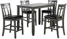 a table and four chairs with black leather seats