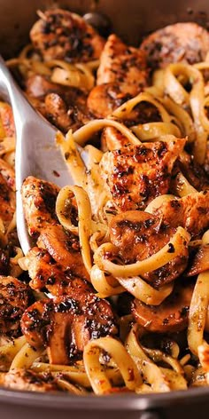 pasta with chicken and sauce in a pan