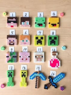 some pixelo beads are arranged on a table with numbers for each one to be spelled