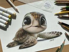 a pencil drawing of a turtle on top of a paper next to crayons