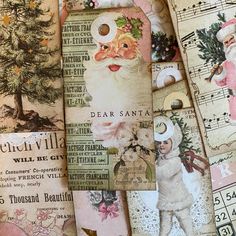 several christmas tags are laid out on top of sheet music sheets and other papers that have been altered to look like santa claus