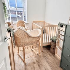 a baby's room with a rocking chair and crib