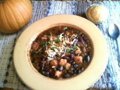 a bowl of chili with beans and cheese