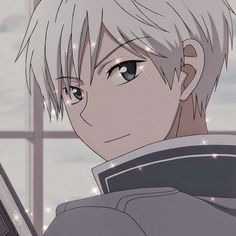 an anime character with short white hair and blue eyes looking at something in front of him