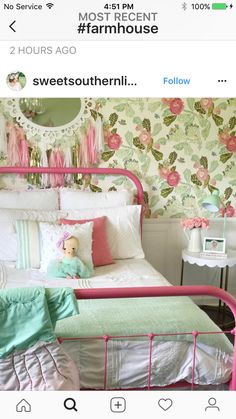 a bed with pink and green decor on it