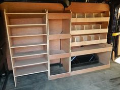 the inside of a van with shelves in it