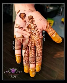 a woman's hand painted with hendi designs