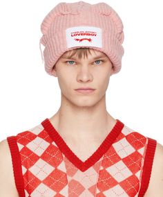 Rib knit RWS-certified lambswool and recycled nylon-blend beanie in pink. Exposed seams throughout. · Textile logo patch at rolled brim · Graphic appliqués and loose threads at crown Supplier color: Pink Loverboy Beanie, Charles Jeffrey Loverboy, Charles Jeffrey, Funky Hats, Textile Logo, Exposed Seams, Red Hats, Luxury Streetwear, Patch Logo