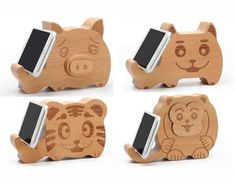 three wooden toy animals with cell phones in them