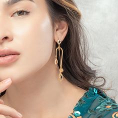 Elevate your look with our Devil Eye Earrings. Handcrafted with intricate detail, these statement pieces are sure to add timeless beauty to any ensemble. An eye-catching gold plating ensures they won't go unnoticed, while the intricate design offers a sense of sophistication and style. A unique and luxurious accessory to exceed all expectations. DETAILS Plating: 18K Gold Materials: 18K Gold on Brass, Cubic Zirconia, Silver Size: 3.03"*0.59"(77mm*15mm) Weight: 9.75g Elegant Hoop Earrings With Dangling Charms, Elegant Drop Earrings With Dangling Charms, Elegant Metal Earrings With Dangling Charms, Elegant Gold Plated Earrings With Dangling Charms, Elegant Gold Plated Drop Chandelier Earrings, Elegant Filigree Gold-plated Danglers, Elegant Gold Plated Filigree Danglers, Gold Plated Dangle Earrings With Elegant Design, Elegant Dangle Gold Plated Earrings