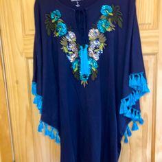 Beautiful Navy Blue Tunic With Turquoise Tassels, Fringe, Sequins. Olive, Lime Green, And Tan Embroidery. Never Worn. Smoke Free Home. Blue Tassel Tops For Beach, Blue Beach Tops With Tassels, Beach Blue Tops With Tassels, Bohemian Blue Top With Tassels, Blue Tassel Tops For Summer, Beaded Blue Tops For Spring, Blue Beaded Tops For Spring, Spring Blue Beaded Tops, Blue Bohemian Beaded Top