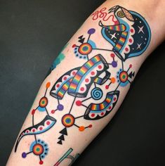 a person with a colorful tattoo on their arm