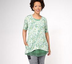 Delightfully designed to show off an easy-breezy layered look, this tank-and-tee twinset takes the guesswork out of everyday outfitting. The tee boasts a bold allover print, while the color-coordinated lace-hemmed tank peeks out the bottom in fab fashion. From LOGO by Lori Goldstein®. Trendy Spring T-shirt For Layering, Trendy Graphic Print Tops For Layering, Casual Layered Tops For Spring, Graphic Print T-shirt For Spring Layering, Graphic Print T-shirt For Spring, Casual Spring T-shirt For Layering, Casual Spring Layering T-shirt, Trendy T-shirt For Spring Layering, Green Relaxed Fit T-shirt For Layering