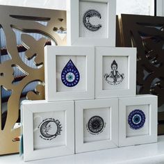 four framed pictures with different designs on them