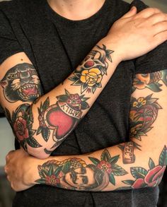 a man with tattoos on his arm and arms