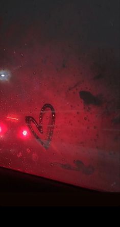 the back window of a car with red lights