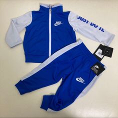 New 2 Pieces Playful Blue Pants With Pockets, Nike Long Sleeve Blue Set, Nike Blue Playtime Sets, Nike White Long Sleeve Set, Nike White Playtime Sets, Playful Nike Cotton Bottoms, Sporty Blue Bottoms For Playtime, Blue Playful Playwear Pants, Playful Blue Pants For Playwear