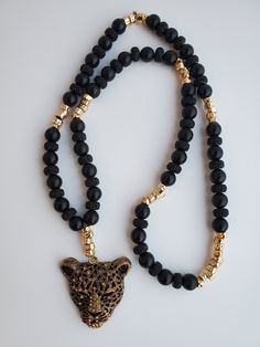 The Ghost of the Forest Necklace is made with Large 10mm Black Onyx Beads, gold spacers, and an eye catching black and gold panther pendant. Onyx crystals connect you with the realm of the night, where your true self can be found. Black onyx is a protection stone. Its purpose is to help prevent the drain of personal energy while at the same time absorbing and transforming negative energy DISCLAIMER: WE ARE NOT MEDICAL DOCTORS AND DO NOT WORK IN THE MEDICAL FIELD. WE MAKE NO CLAIMS REGARDING MEDI Panther Necklace, Forest Necklace, Onyx Crystal, Personal Energy, Types Of Crystals, Nose Jewelry, Protection Stones, Medical Field, Onyx Bead