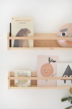 two wooden shelves with books and toys on them