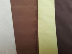 three different colors of fabric with stitching on the bottom and bottom half of them