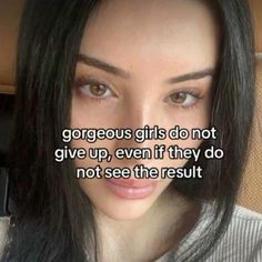 a woman with long black hair is looking at the camera and has a quote on her face