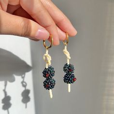 Where my garnish girls at?! INSPIRATION - the best part of a martini deserves its own earring COMPOSITION - handwoven with delicate glass Japanese seed beads. each earring comes with 2 olives on a hand twisted "wooden" pick EARRING - choice of yellow gold hoops or ear wire DIMENSIONS - hang ~2 in long, 0.5in wide Olive Earrings, Hanging Earring, Beaded Stuff, Beaded Crafts, Hanging Earrings, Single Earring, Gold Hoops, Diy Earrings, Ear Wire