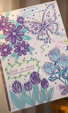 a card with flowers and butterflies on it