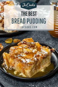 the best bread pudding recipe on a black plate with caramel syrup and nuts around it