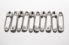 an assortment of metal handles on a white background