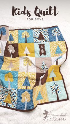 a quilted blanket with the words kids quilt for boys on it