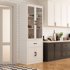 a kitchen with black and white checkered flooring next to a wall mounted oven