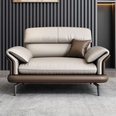 a white leather couch sitting on top of a carpeted floor next to a wall