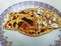 two quesadillas on a purple and white plate