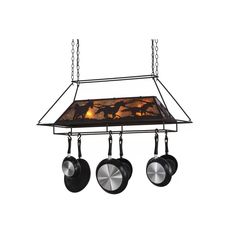 an oven with pots and pans hanging from it