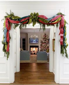 a living room decorated for christmas with decorations