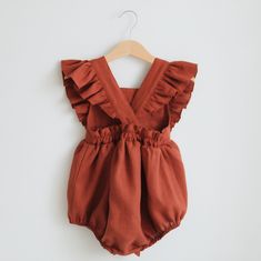 The price is for one vintage bubble playsuit, other pictured items are not included. This vintage bubble playsuit is made of medium weight prewashed pure linen fabric. Features sleeve ruffles, elastics at leg, back with wooden buttons straps, snaps at the crotch for easy changing. Material: 100% linen, Oeko-Tex 100 certified. Sizing Guidelines (runs big and fits better on a maximum age range indicated, if between sizes better size down): Newborn (52 cm / 20,5 in. height; 39,5 cm / 15,5 in. chest Cotton Bubble Romper With Ruffles For Playdate, Cotton Ruffle Bubble Romper For Playdate, Solid Color Bubble Romper With Ruffles For Playtime, Ruffled Bubble Romper For Playwear, Playtime Bubble Romper With Ruffles, Vintage Romper, Trendy Baby Clothes, Vintage Baby Clothes, Linen Romper