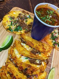 mexican food with tortillas and salsa on a cutting board