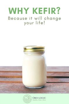 a glass jar filled with milk sitting on top of a wooden table