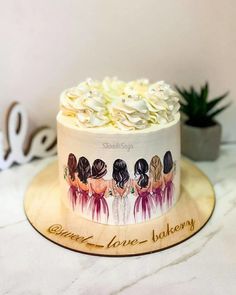 there is a cake with three women on it