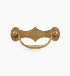 an old brass door handle on a white background