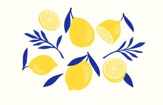 the lemons are arranged in a circle with blue leaves on each side, and one is cut in half