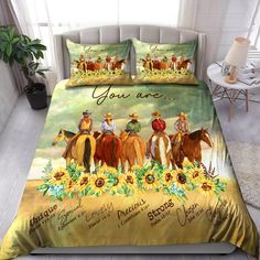 a bed with horses and sunflowers on it