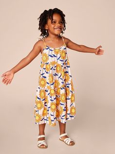 Inspired by our travels to Kenya, our artists created this original print for this Tie Shoulder Tiered Dress. Fancy enough for special outings, this customer favorite frock is also made for everyday wear. It's so comfy and easy to wear. Plus, it's the perfect dress for unlimited twirling. Made from 100% soft cotton, it keeps the color and styling, wash after wash. Calf length. Matching family styles are available in our Family Shop. Casual Multicolor Sundress For Playdate, Casual Summer Twirl Dress For Playwear, Multicolor Twirl Dress For Playdate In Summer, Multicolor Twirl Dress For Summer Playdate, Fun Summer Twirl Dress For Playdate, Playful Spring Sundress For Playwear, Playful Sundress For Summer Playdate, Casual Sundress For Playtime In Spring, Casual Multicolor Twirl Dress For Playdate